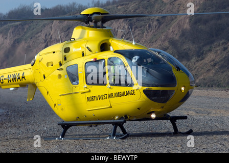 North West Air Ambulance Helicopter on beach Stock Photo