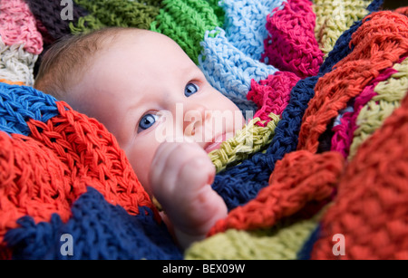 Portrait of three month old baby girl with big blue eyes Stock Photo