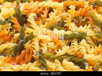 Multicolored pasta with the addition of natural tomatoes and spinach Stock Photo