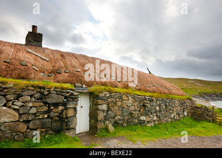 Restored traditional croft in the Garenin Blackhouse Village on the Isle of Lewis, Scotland Stock Photo