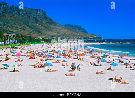 Sunbathers at Camps Bay below Table Mountain in Cape Town on Western Cape of South Africa Stock Photo