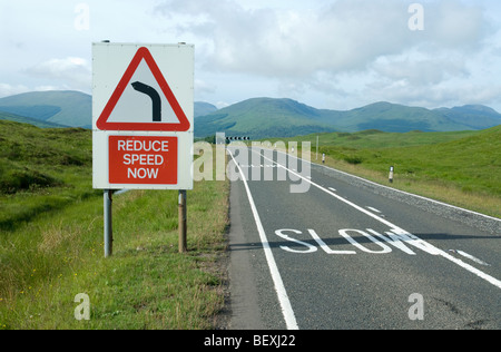 Road sign warning to slow down on the Rannoch Moors, Scotland Stock Photo