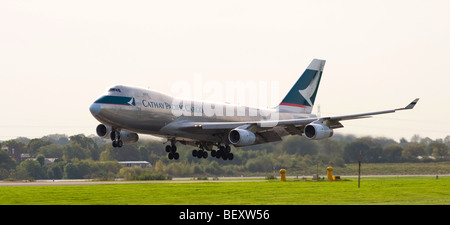 Cathay Pacific Cargo Boeing 747-400 Freighter Airliner B-HUP Touching Down on Runway at Manchester International Airport England Stock Photo