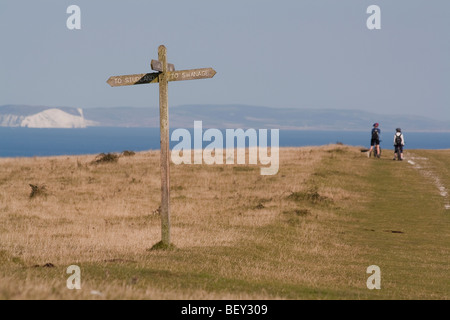 A signpost on Ballard Down points the way to Studland and Swanage, Dorset, UK Stock Photo