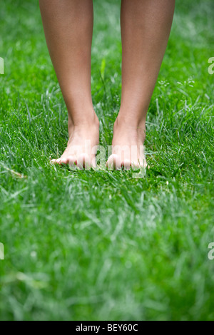 Feet on a meadow Stock Photo - Alamy