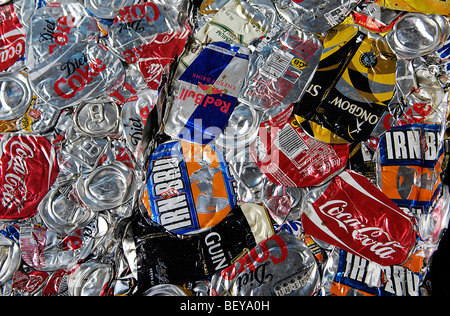 A block of crushed metal drinks cans that are being prepared for recycling. Stock Photo