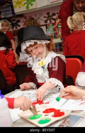 Young pupils dressed in Welsh national costumes for International Day at Ysgol Gymraeg Aberystwyth welsh medium primary school. Stock Photo