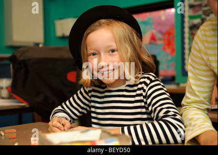 Young pupils dressed in a French national costumes for International Day at a  welsh language medium primary school. Stock Photo