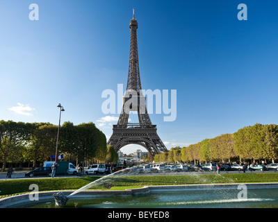 The Eiffel Tower 320m 1050ft high viewed from Parc du Champ de Mars Paris France Stock Photo