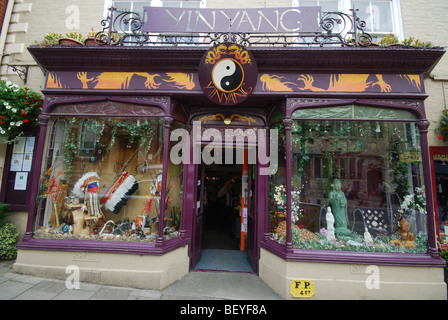 Colourful shop front in Glastonbury High Street Somerset England Stock Photo