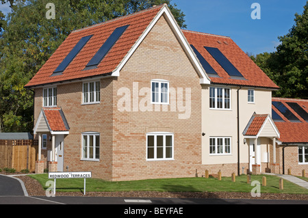 Carbon neutral homes with integrated solar panels Stock Photo