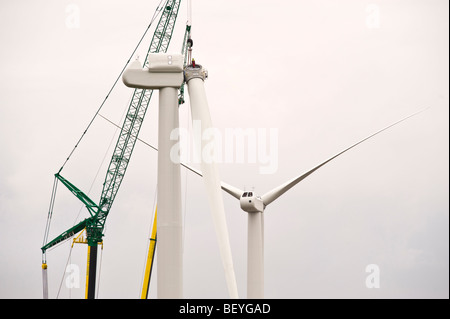 Blades being lifted by cranes for fitting on Nordex N90 wind turbine under construction at Solutia UK Ltd Newport South Wales UK Stock Photo