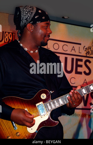 Young man plays the blues on guitar Stock Photo