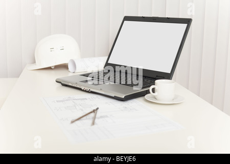 Office workplace of the engineer - the designer with the laptop Stock Photo