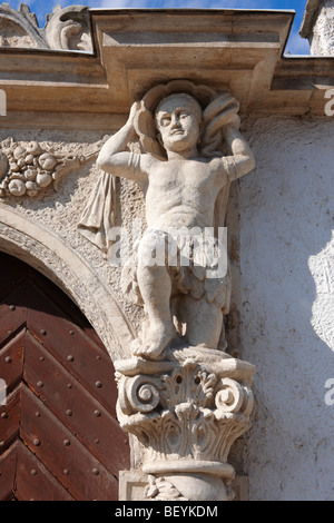 Door statues on The two Moors House (K t m r h z). Rustic Baroque architecture - Sopron, Hungary Stock Photo