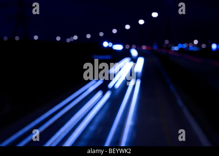 abstract out of focus lights of traffic on a highway at night