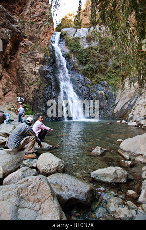 Tourists visiting waterfall in Setti Fatma berber village in Ourika valley, high Atlas mountains , Morocco.