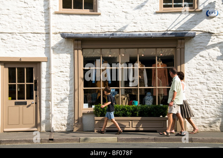 a family walking down street, Tetbury, Gloucestershire, UK Stock Photo