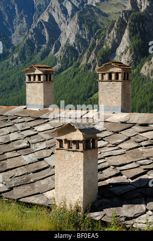 Three Chimneys & Stone Tile Roof at Saint-Véran or Saint Veran Village Quayras French Alps France Stock Photo