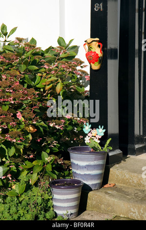 Earthenware pots at the entrance to a house in High Street East Grinstead Stock Photo