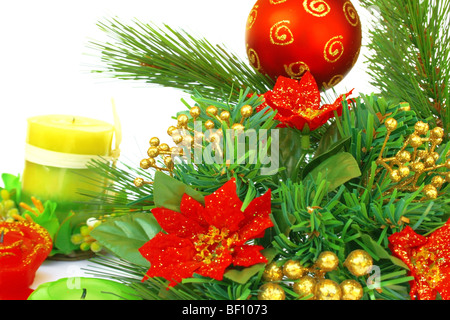 Christmas ornaments.Red ball,holly-berry,candles. Stock Photo