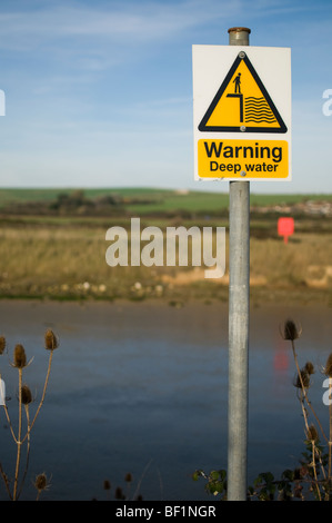 A sign warning of deep water Stock Photo