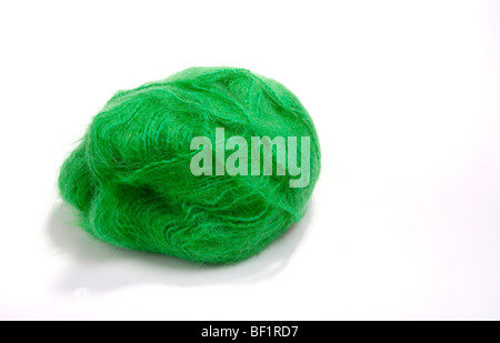 Large ball green mohair wool or yarn against white background. Stock Photo