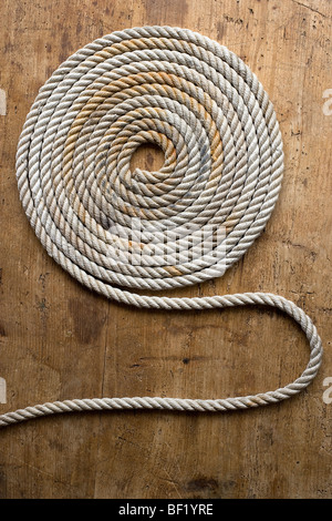 Rope coil on an antique chest Stock Photo