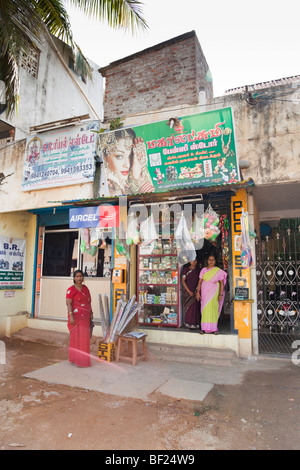 Indian woman standing outside a convenience store. Chennai Tamil Nadu India Stock Photo