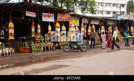 Garlands of flowers being sold in preparation for the Eid ul Fitr festival. Kolhapur Maharashtra India Stock Photo