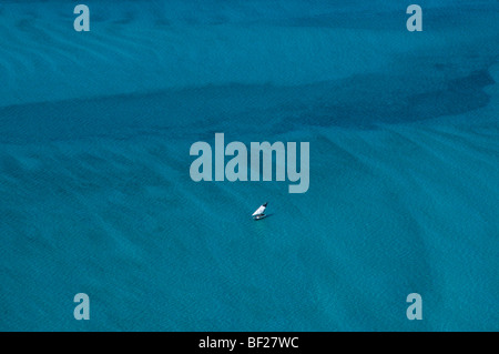 An aerial view of a solitary dhow sailing across the Mozambique Channel, off the coast of Mozambique, southern Africa Stock Photo