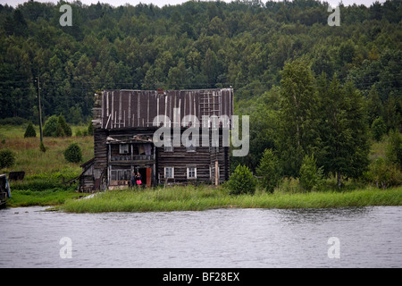 Damaged wooden house, Lake Onega, the second biggest lake in Europe, Russia Stock Photo