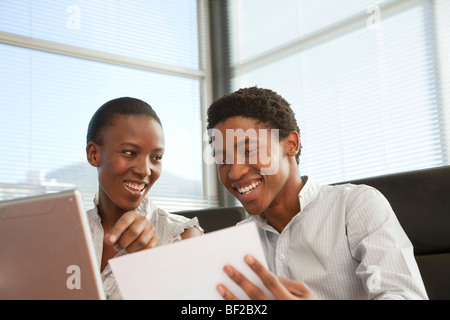 Two business colleagues working together, Cape Town, Western Cape Province, South Africa Stock Photo