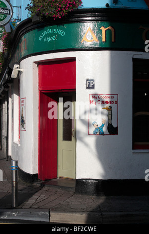 Guinness ads painted on the wall outside The Dew Drop Inn in Galway Ireland Stock Photo