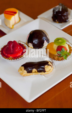 High angle view of assorted tarts and eclairs Stock Photo