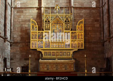 The High Altar and gold trimmed Reredos inside the historical Abbey of St Peter and St Paul in the merchant town of Shrewsbury. Stock Photo