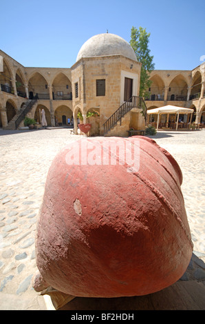 NICOSIA (LEFKOSA), NORTH CYPRUS. A large clay storage jar in the courtyard of the Buyuk Han. 2008. Stock Photo