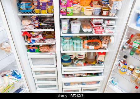 Refrigerator filled with assorted food items Stock Photo