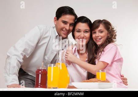 Portrait of a happy family at the breakfast table Stock Photo