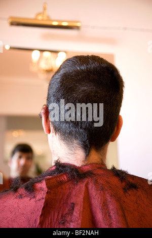 Man having his hair cut - head shot Stock Photo