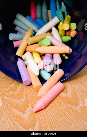 Close-up of crayons spilling out from a container Stock Photo