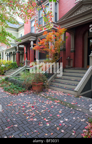 Autumn leaves add to the beauty of these Victorian homes in Portland's Nob Hill Historic District. Stock Photo