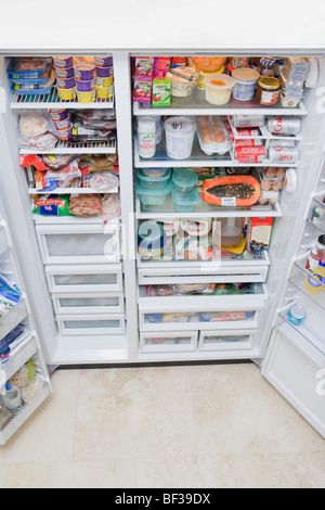 Refrigerator filled with assorted food items Stock Photo