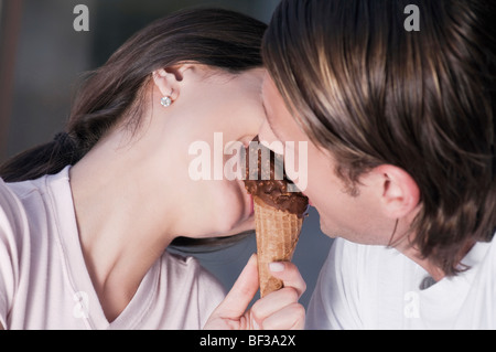 Couple sharing an ice cream Stock Photo