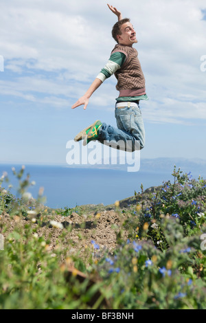 young man jumping in air Stock Photo