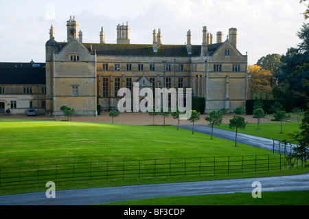 Low  sunlight on the lawn of the Cotswold house at Batsford, nr Moreton in Marsh, Gloucestershire, England. Stock Photo