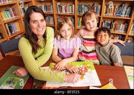 Students and Teacher in School Library Stock Photo