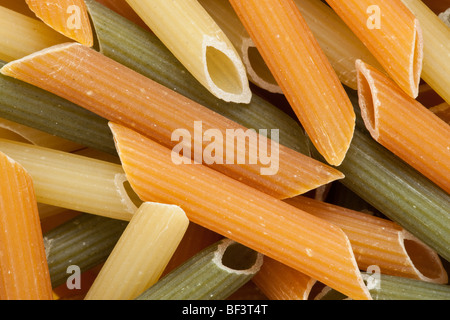 Multicolored pasta with the addition of natural tomatoes and spinach Stock Photo