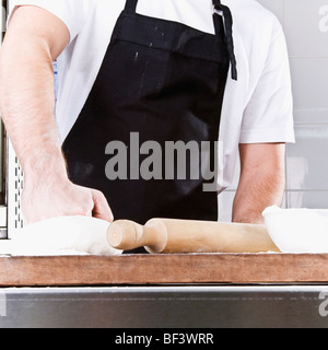 Chef kneading pizza dough Stock Photo