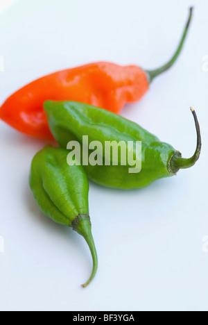Close-up of red and green chili peppers Stock Photo
